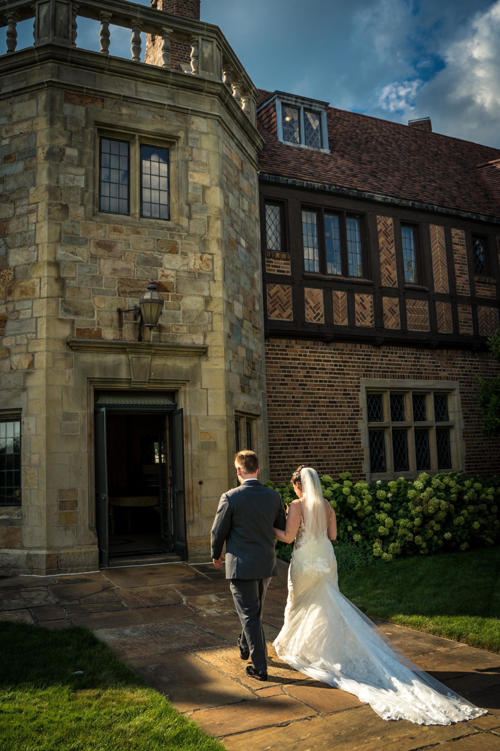 bride and groom walking into meadow brook