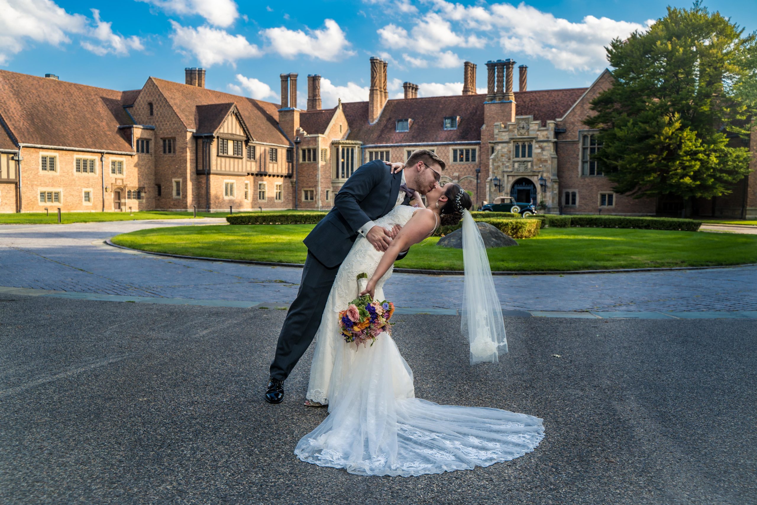 bride and groom kissing meadow brook hall