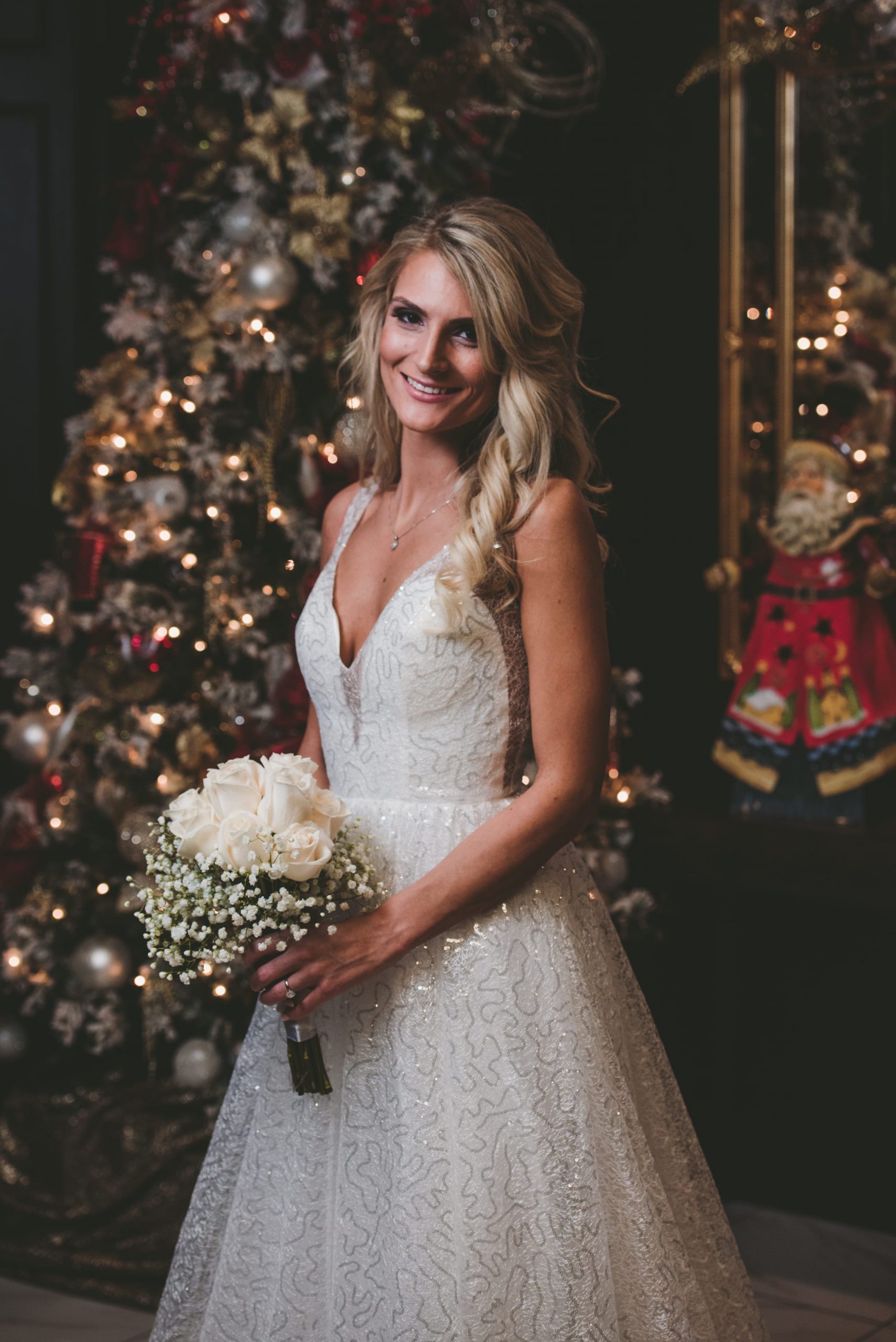 bridal photography in front of Christmas tree 