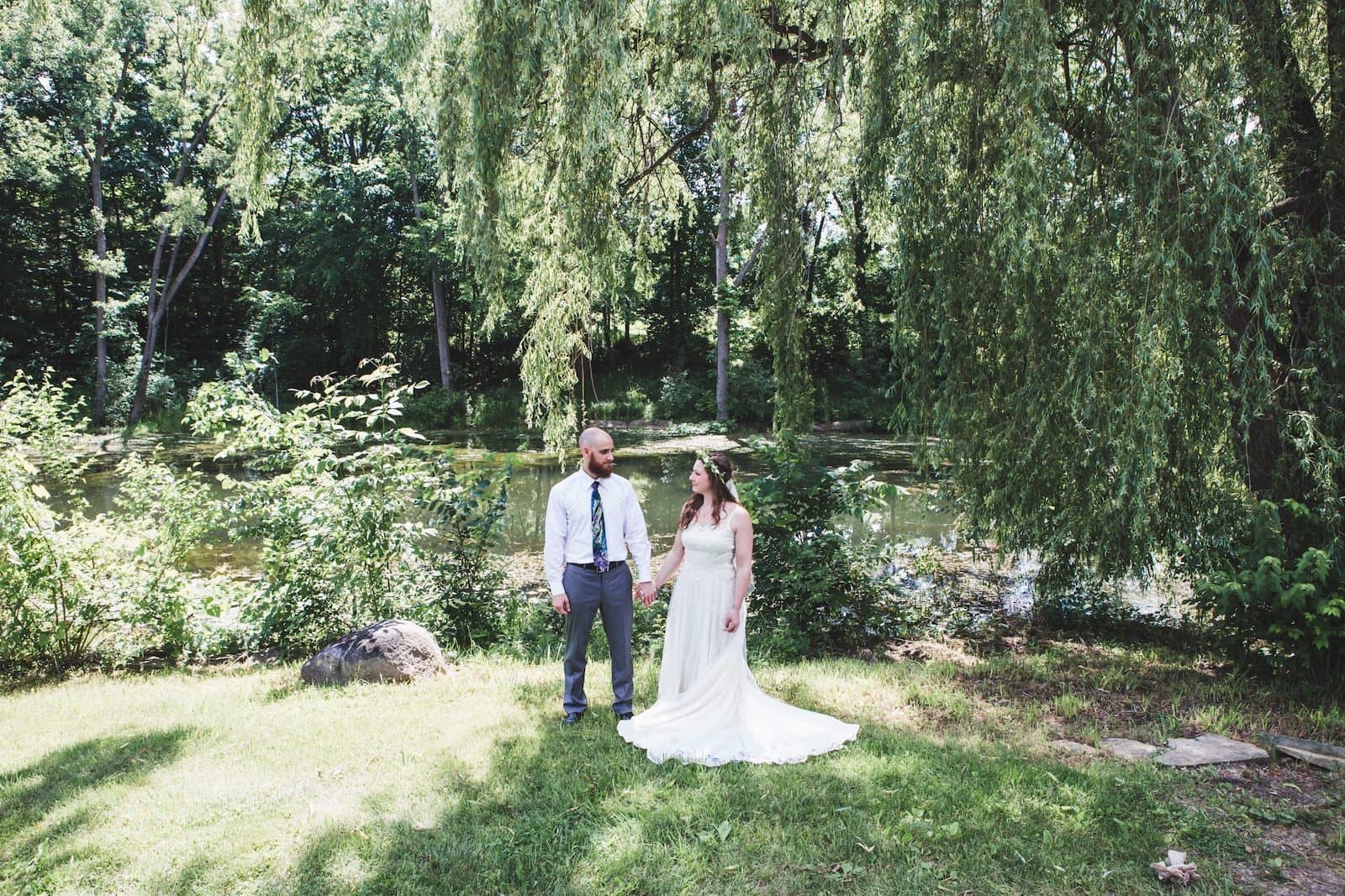 bride & groom holding hands