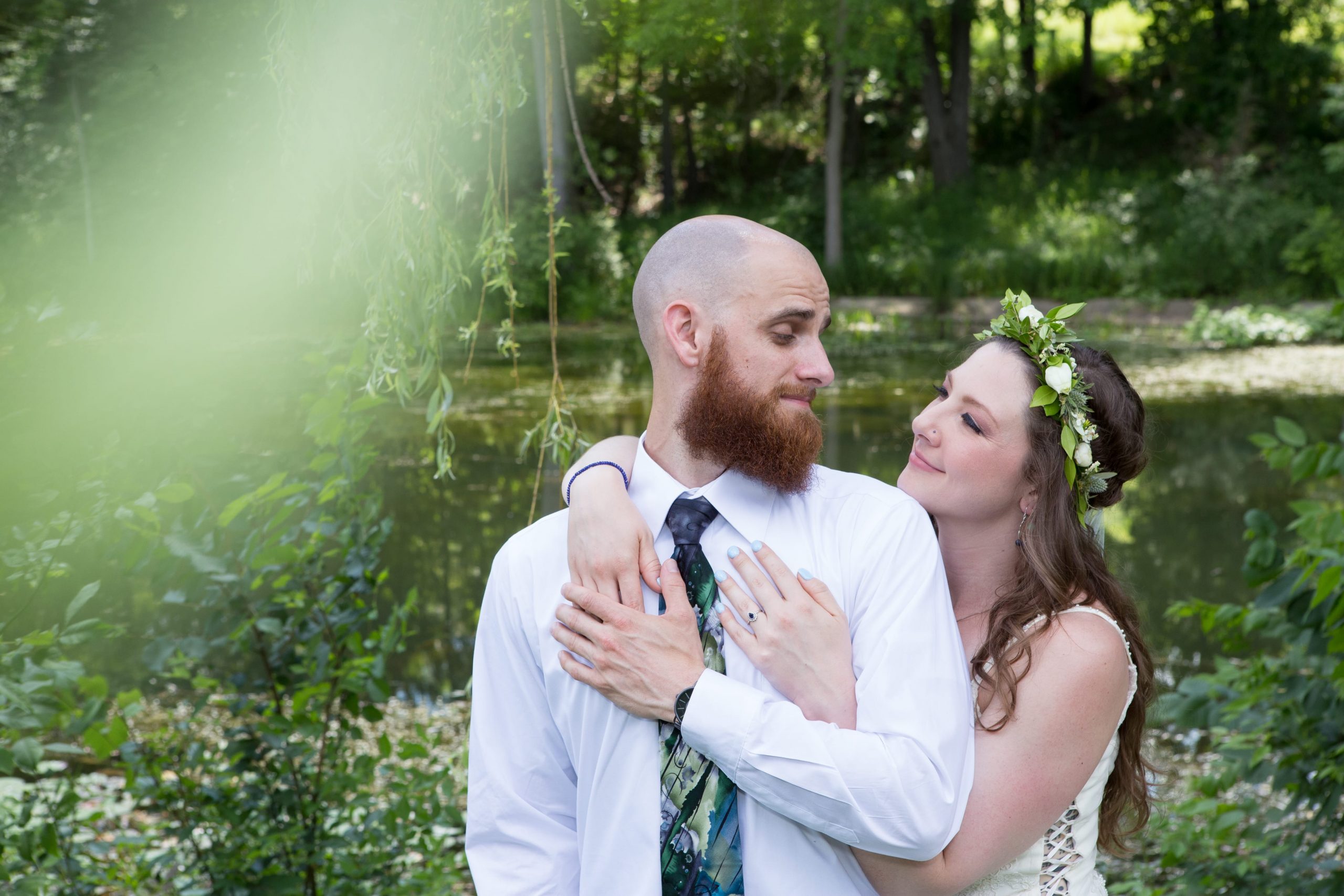 bride and groom embracing during wedding romantics session