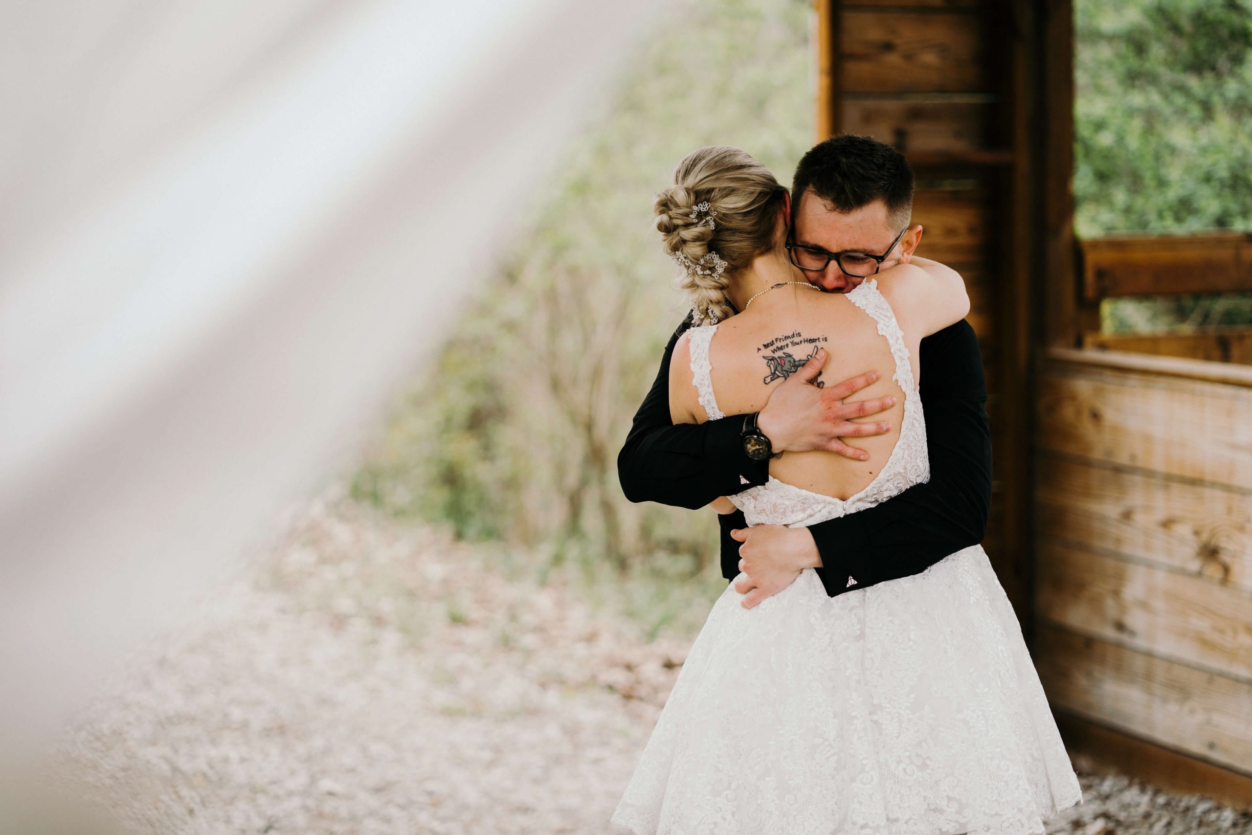 bride and groom hugging 