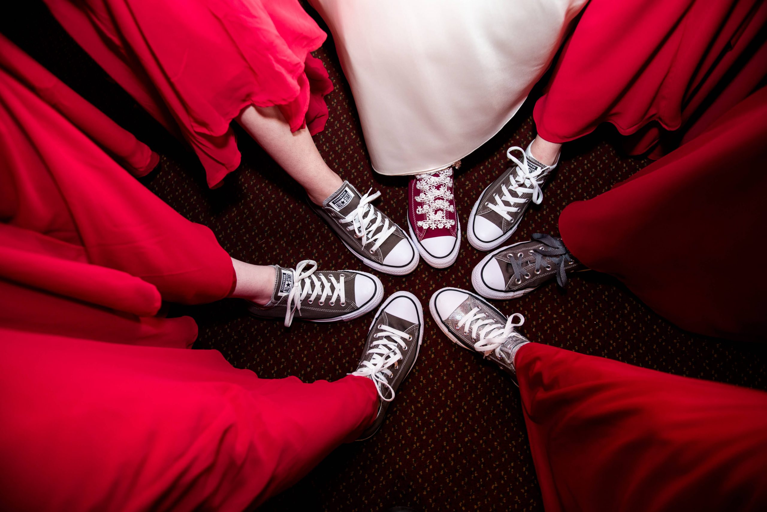 bride and bridesmaids wearing converse