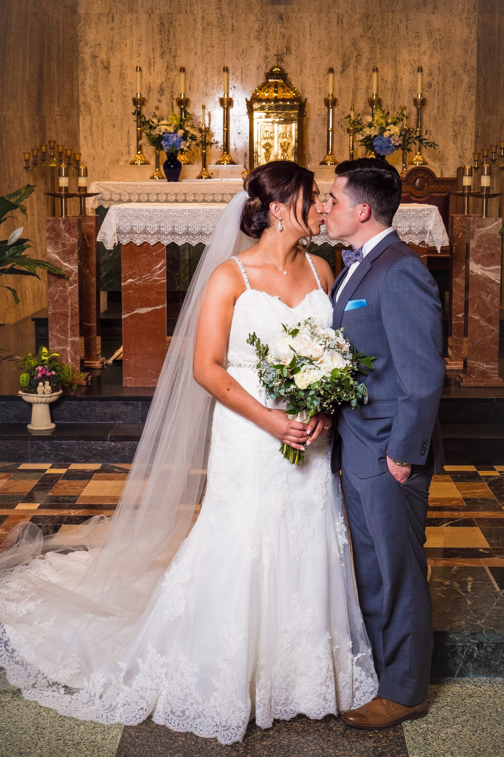 bride and groom kissing wedding ceremony