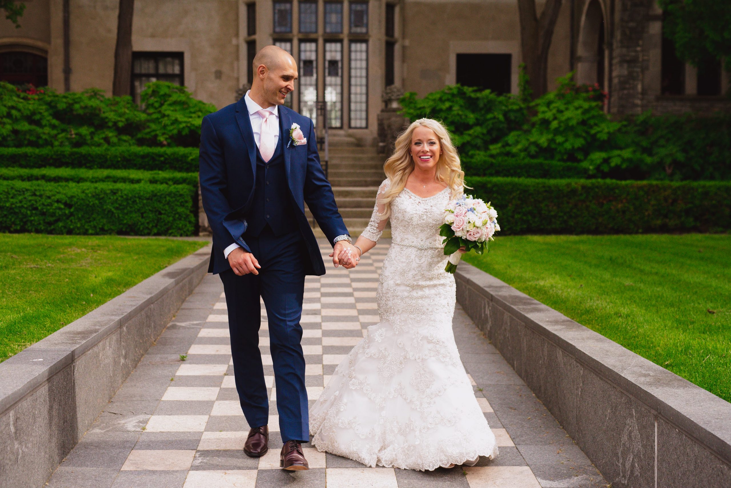 bride and groom walking outside church