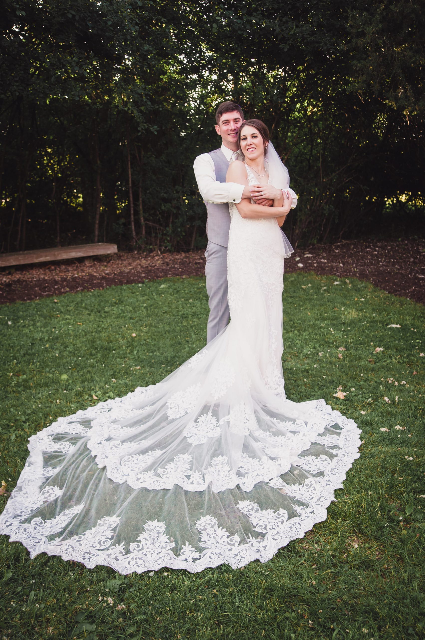 groom holding bride from behind