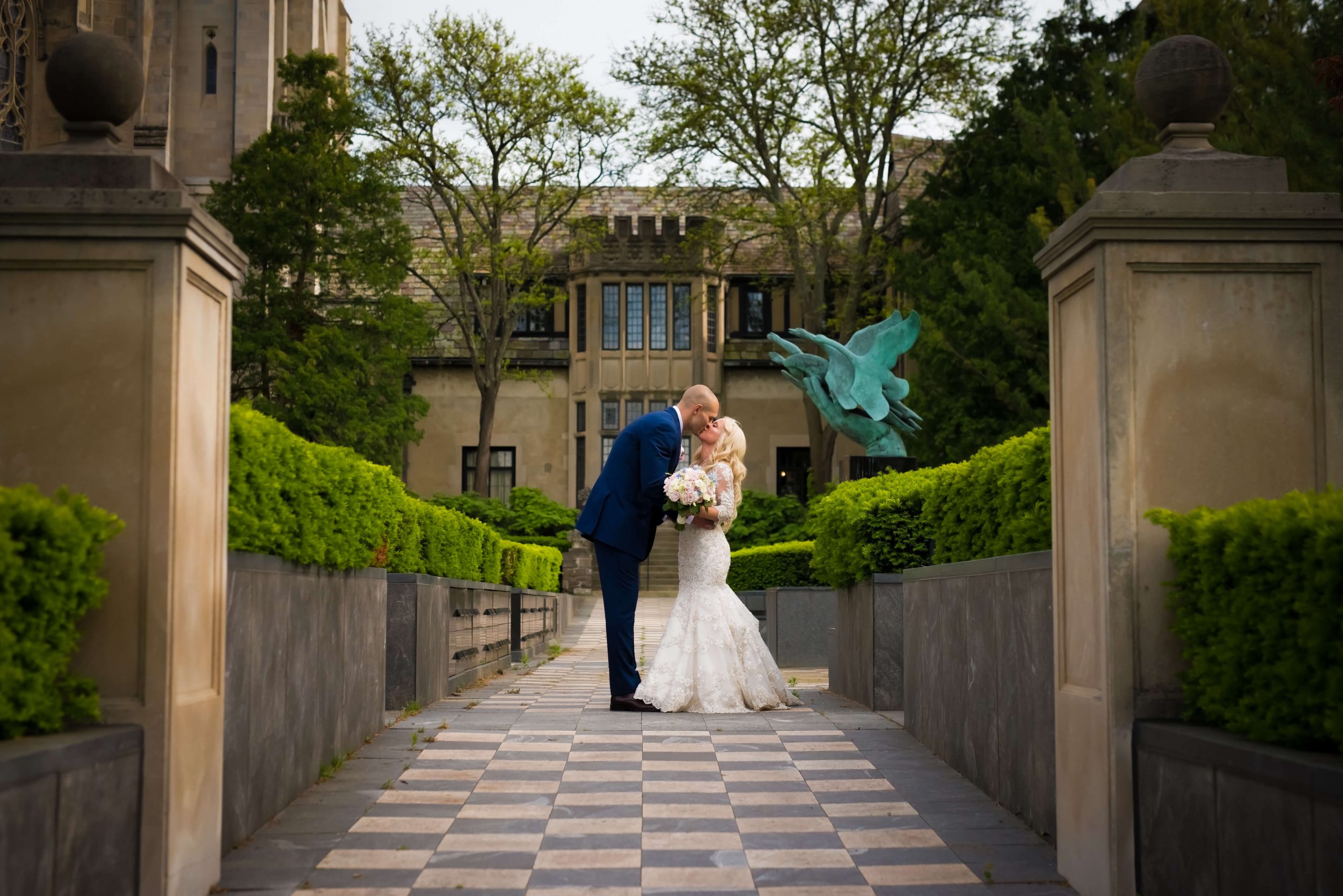 groom leaning to kiss bride