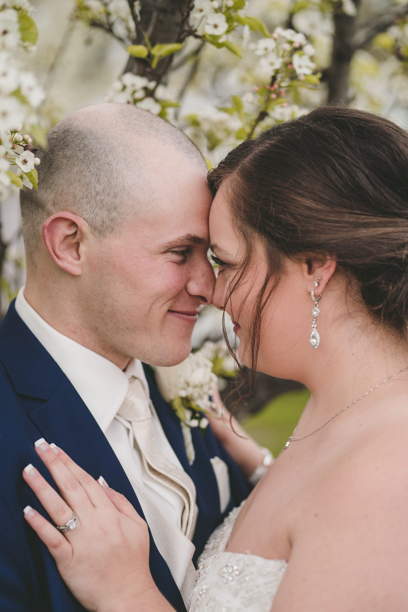 bride and groom forehead to forehead romantic