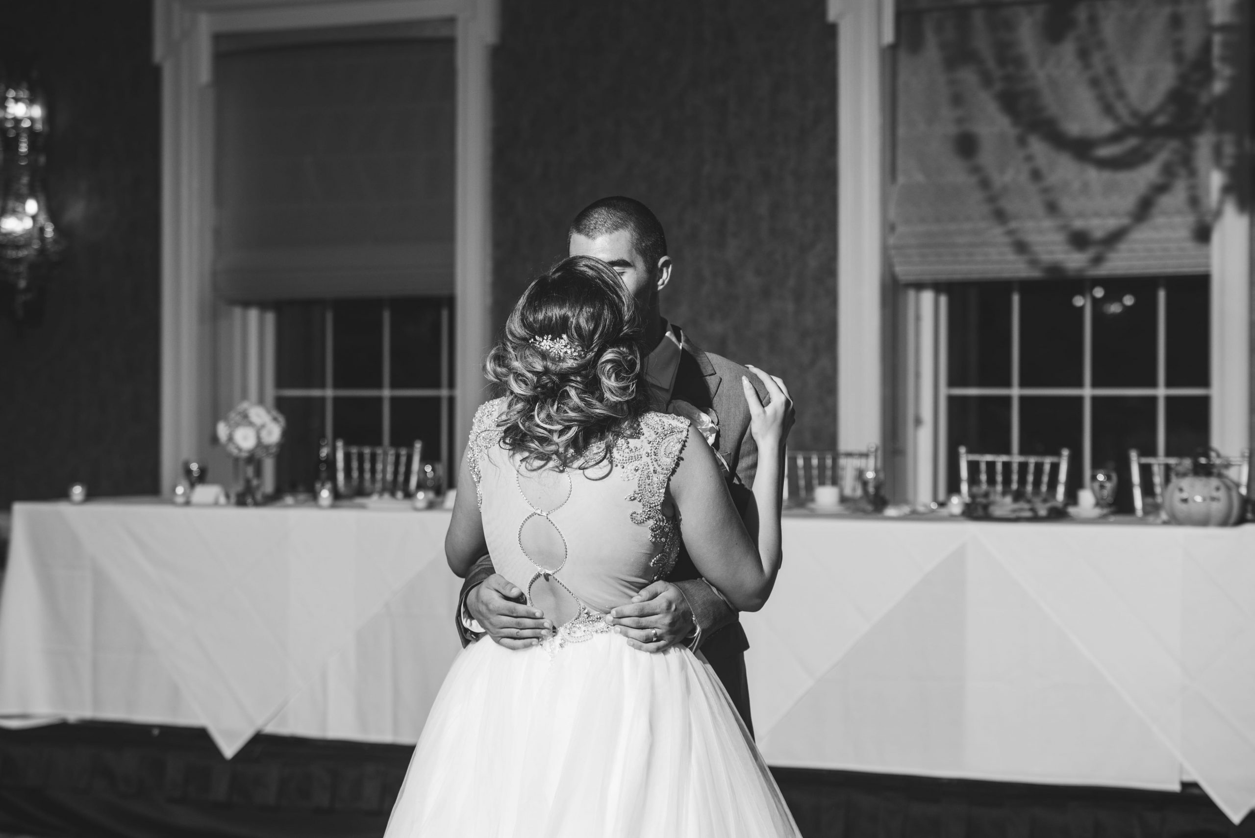 bride and groom kissing during first dance