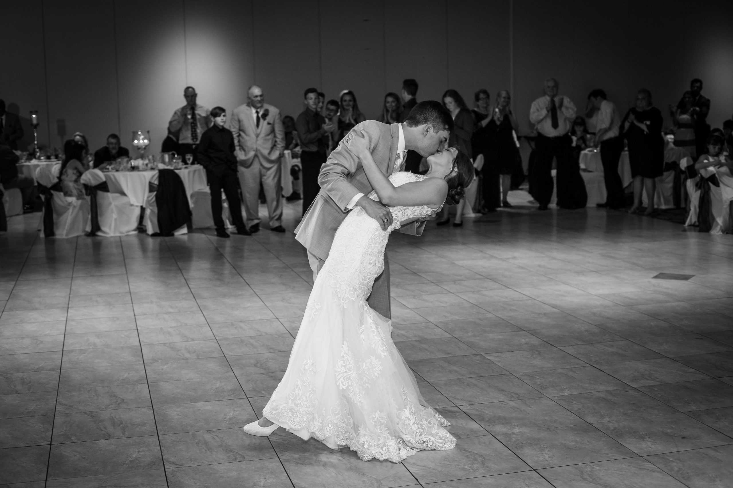 groom dipping bride on dancefloor