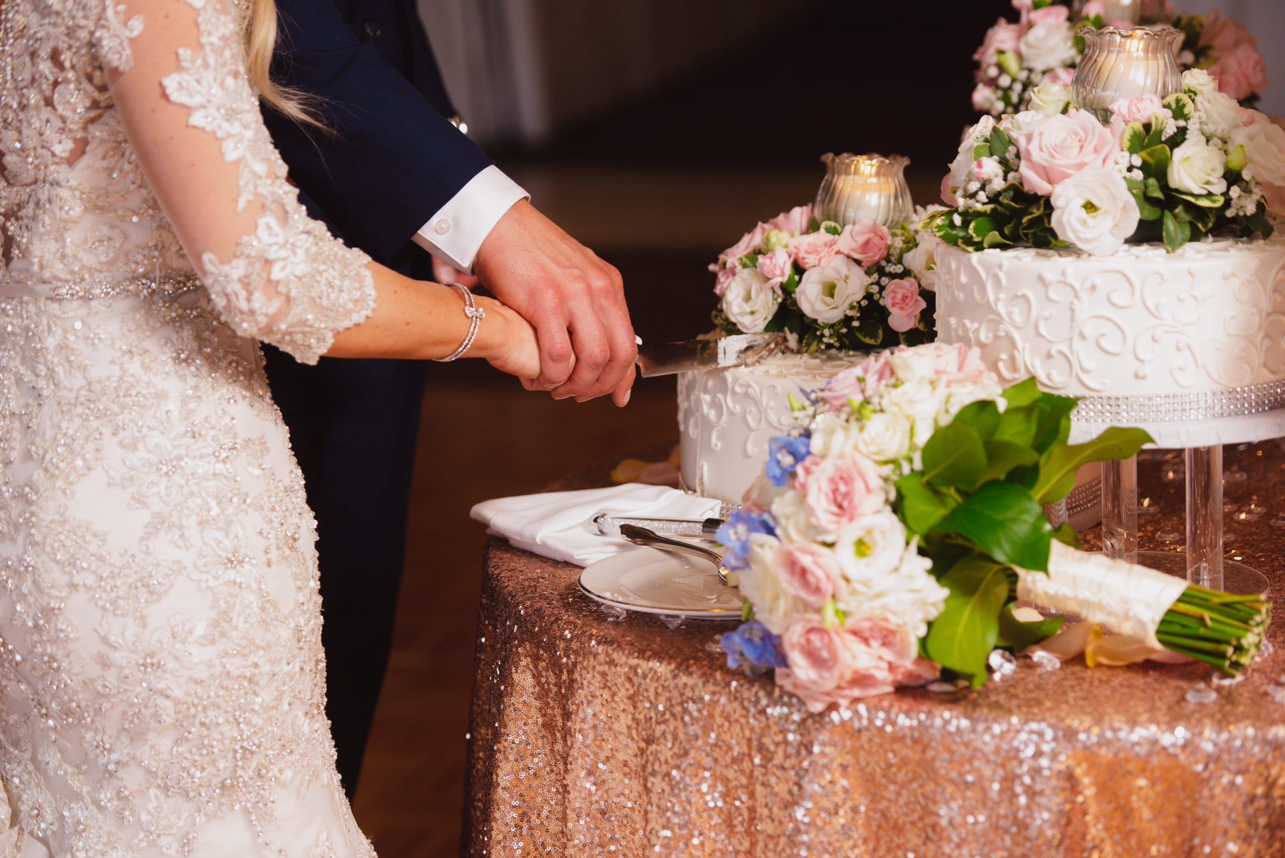 bride and groom cutting cake