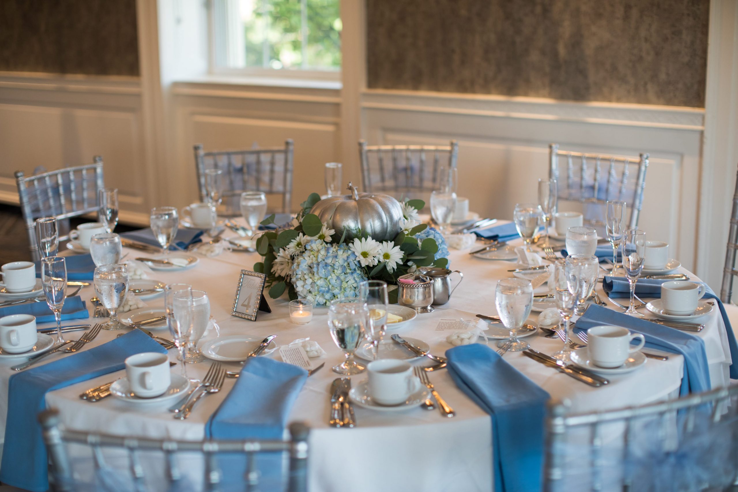 white and blue reception table details