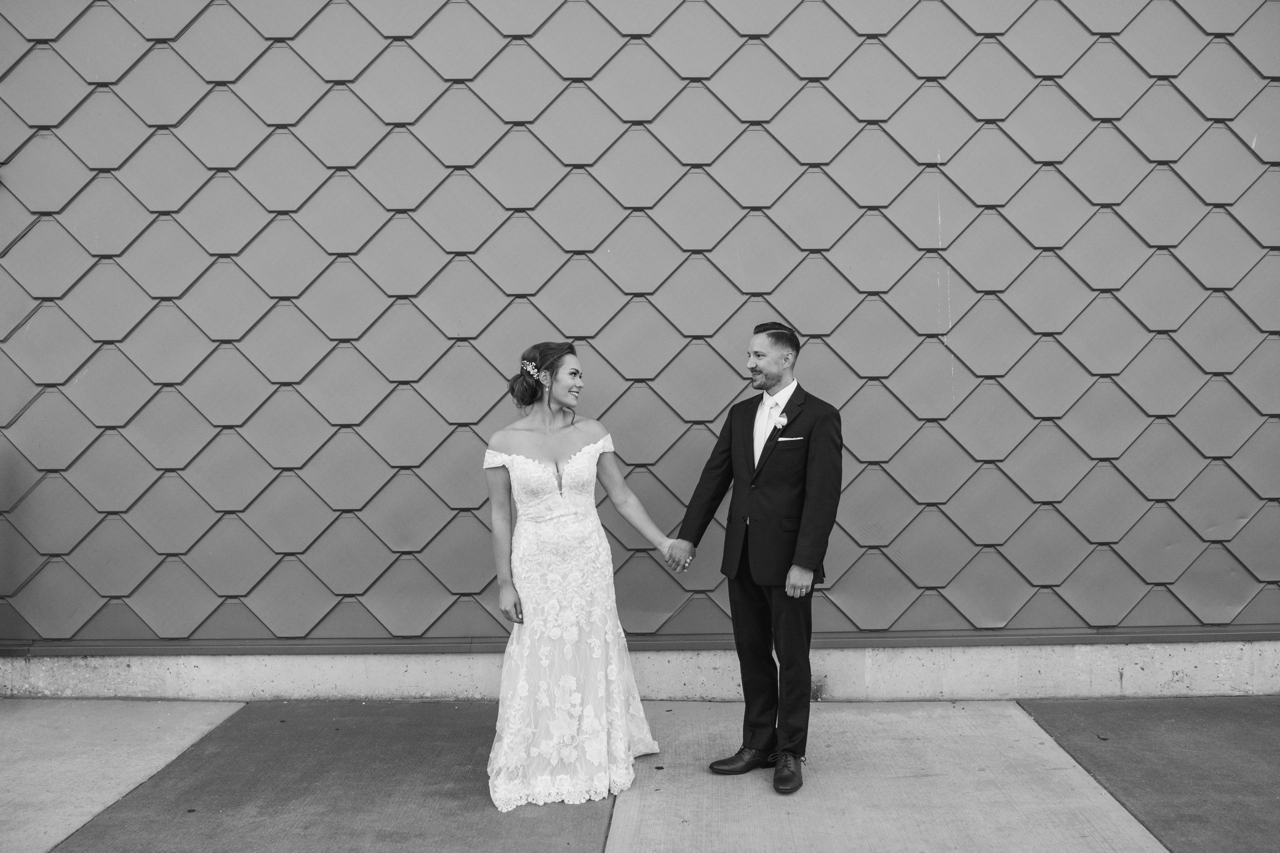 black and white wedding day romantics with artistic wall