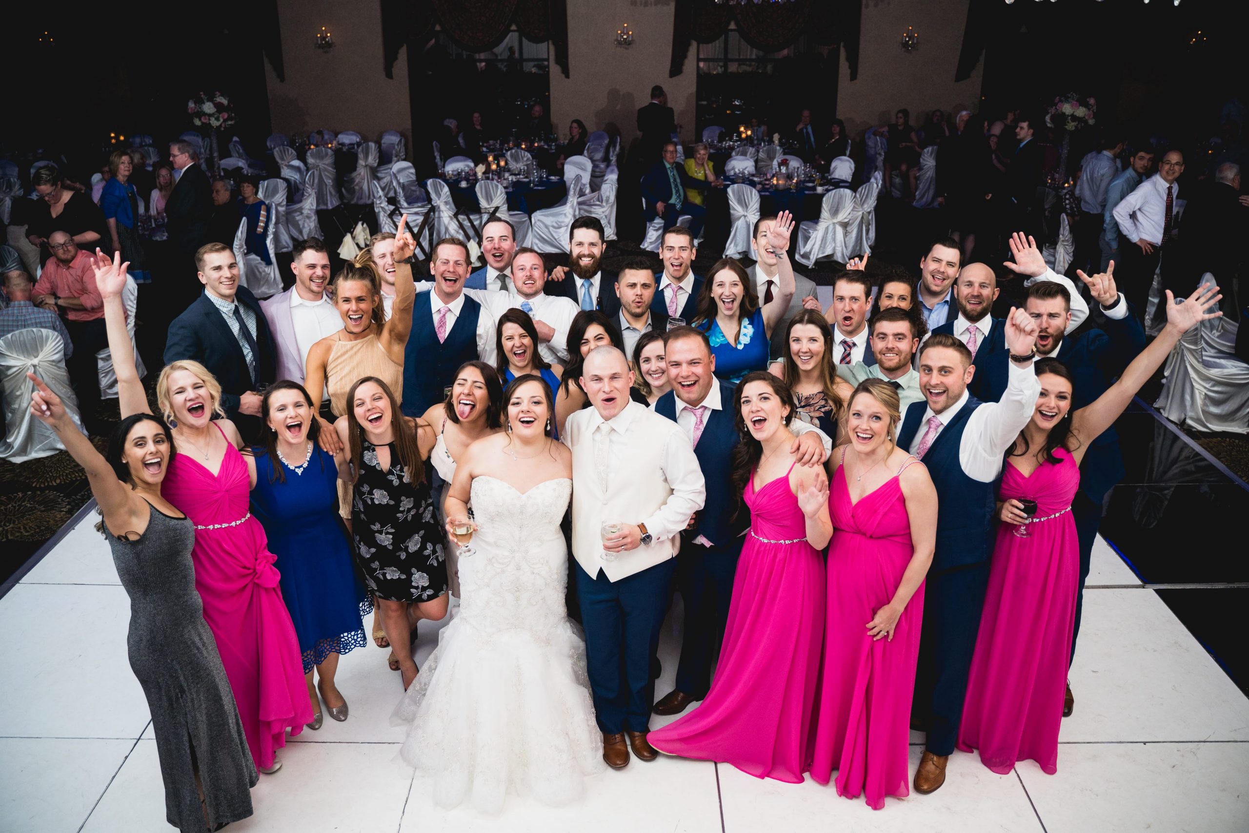 packed dance floor at wedding reception