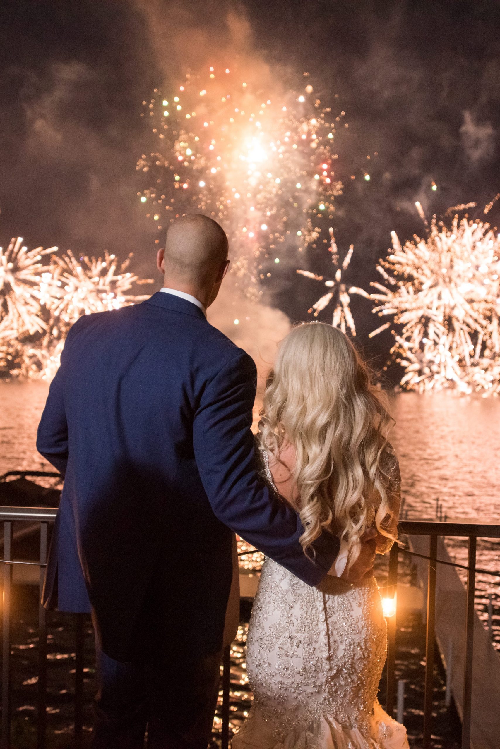 bride and groom watching fireworks