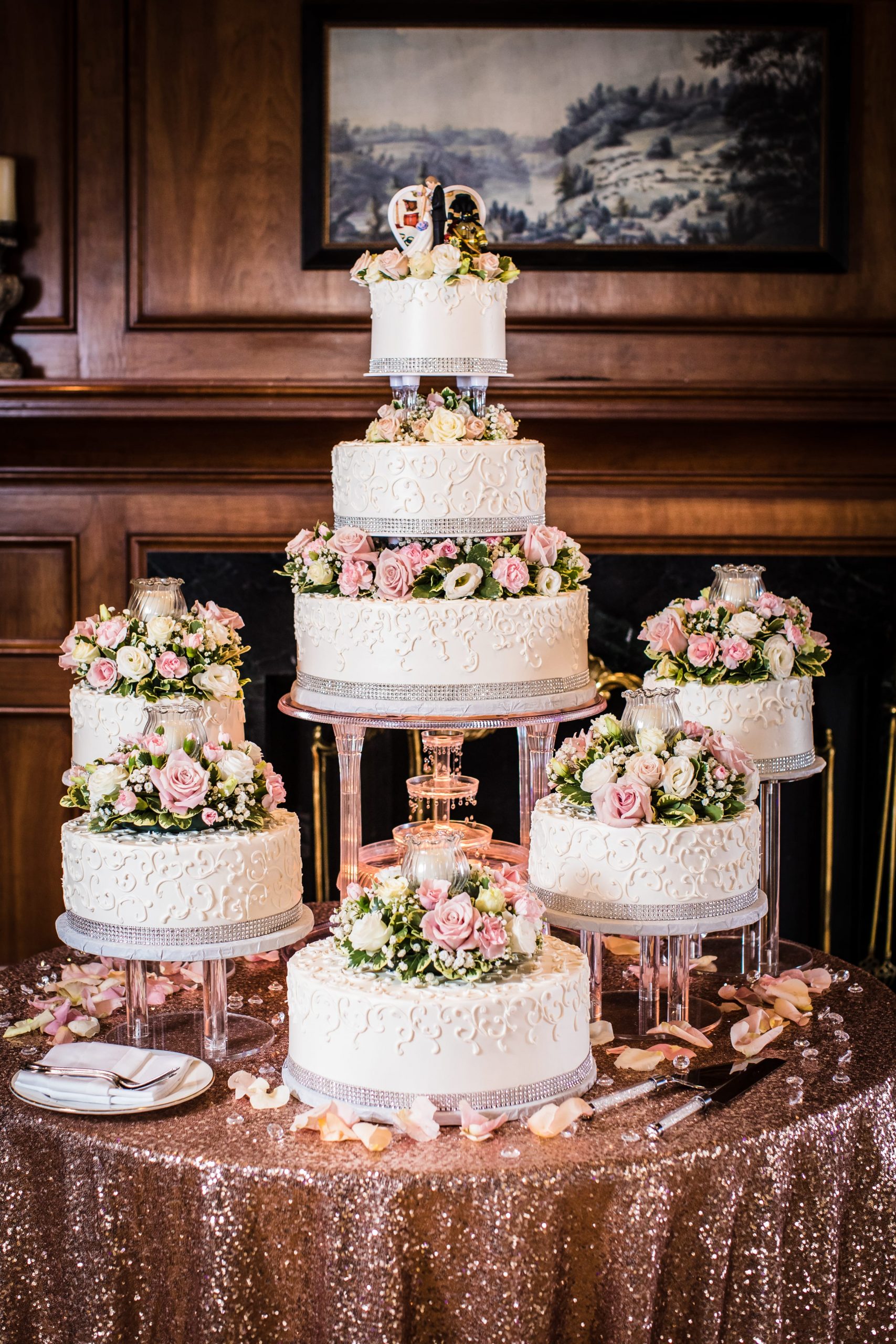 grand wedding cake with rose gold table cloth