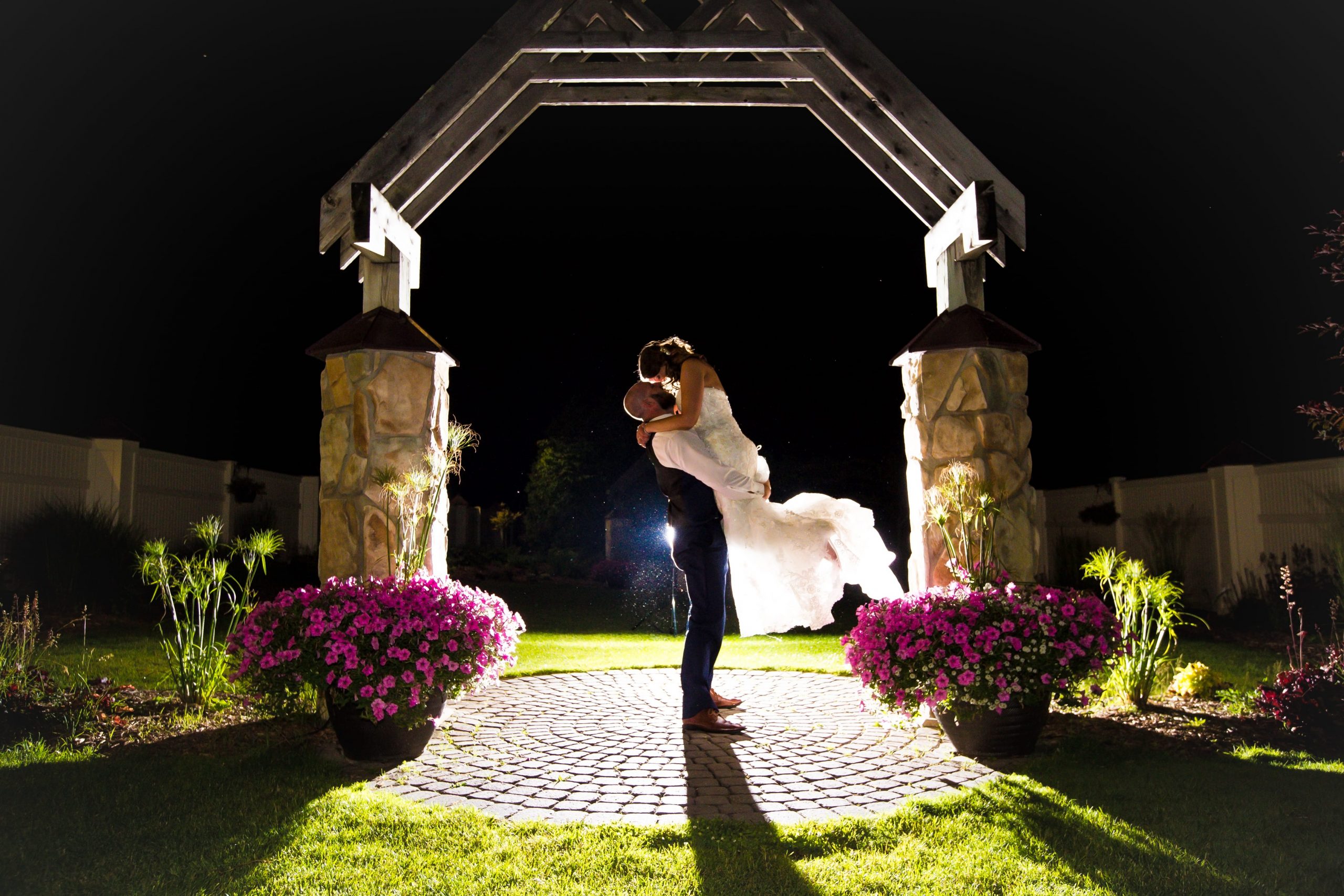 groom lifting bride for evening romantics