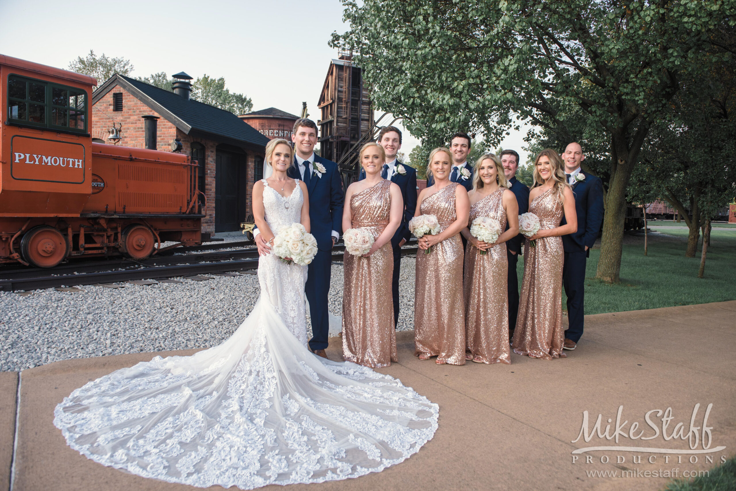 bridal party at henry ford in front of train