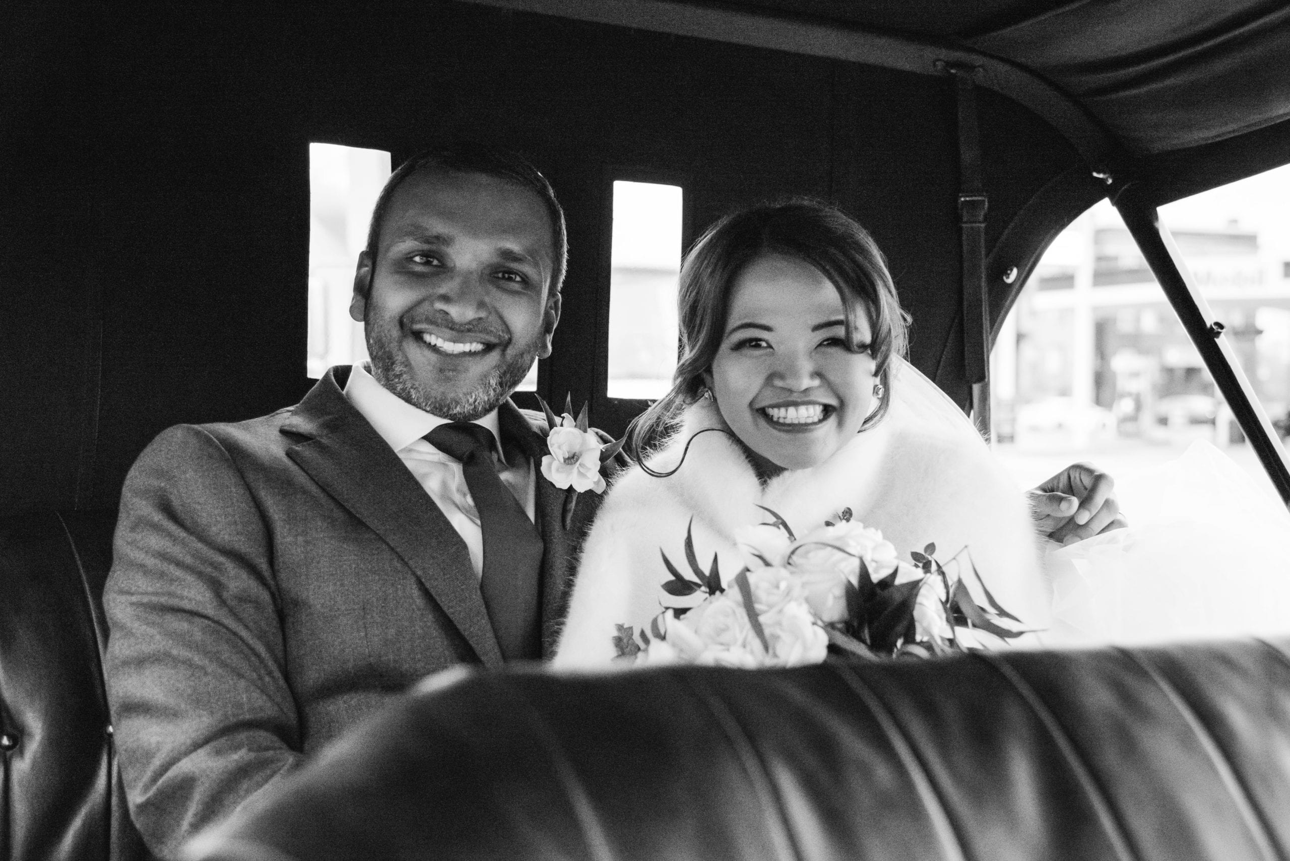 bride and groom driving in Ford Model T