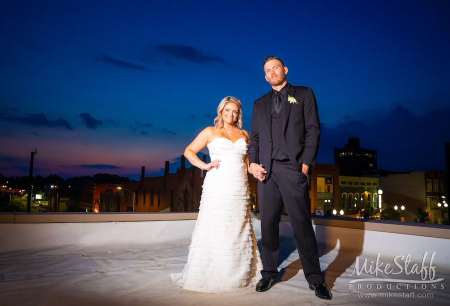 bride and groom evening romantics on rooftop