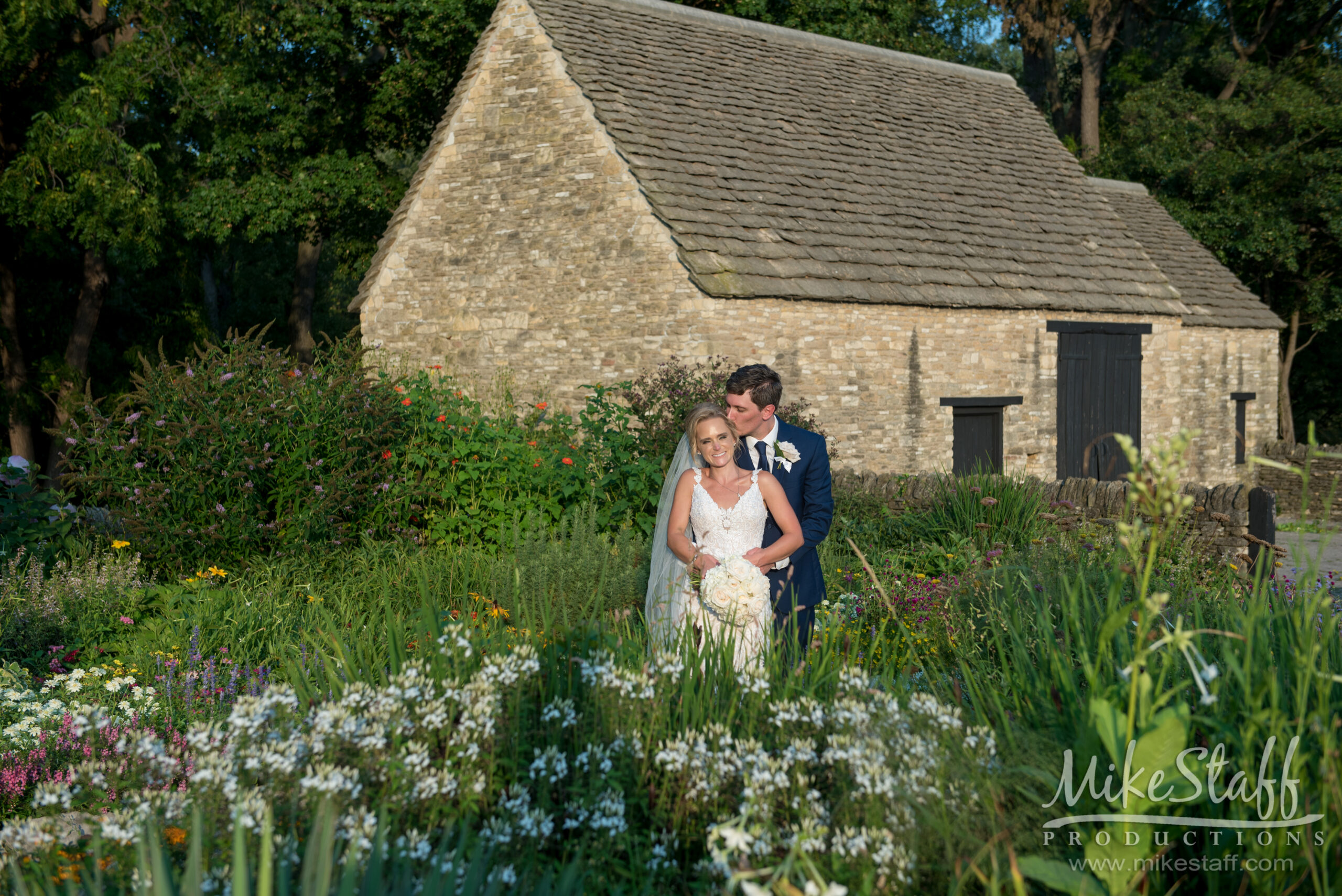 bride and groom in field