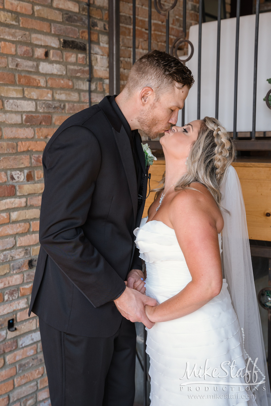 bride and groom kissing