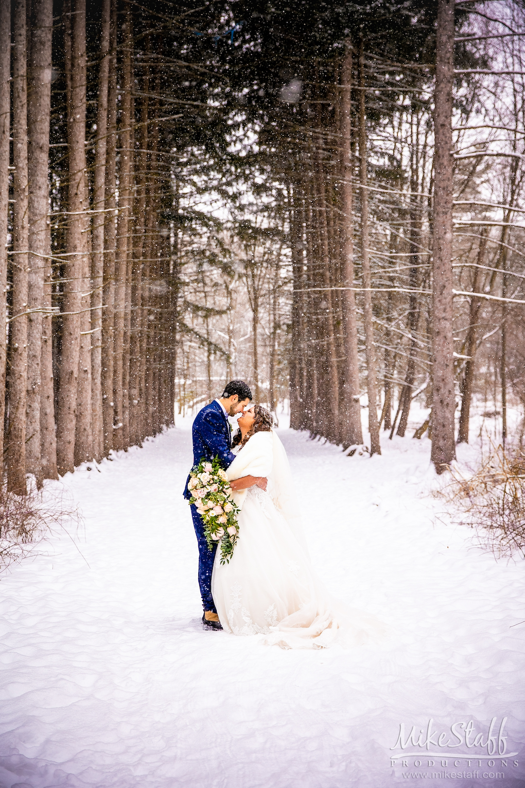 bride and groom outside in snow during winter metro detroit wedding