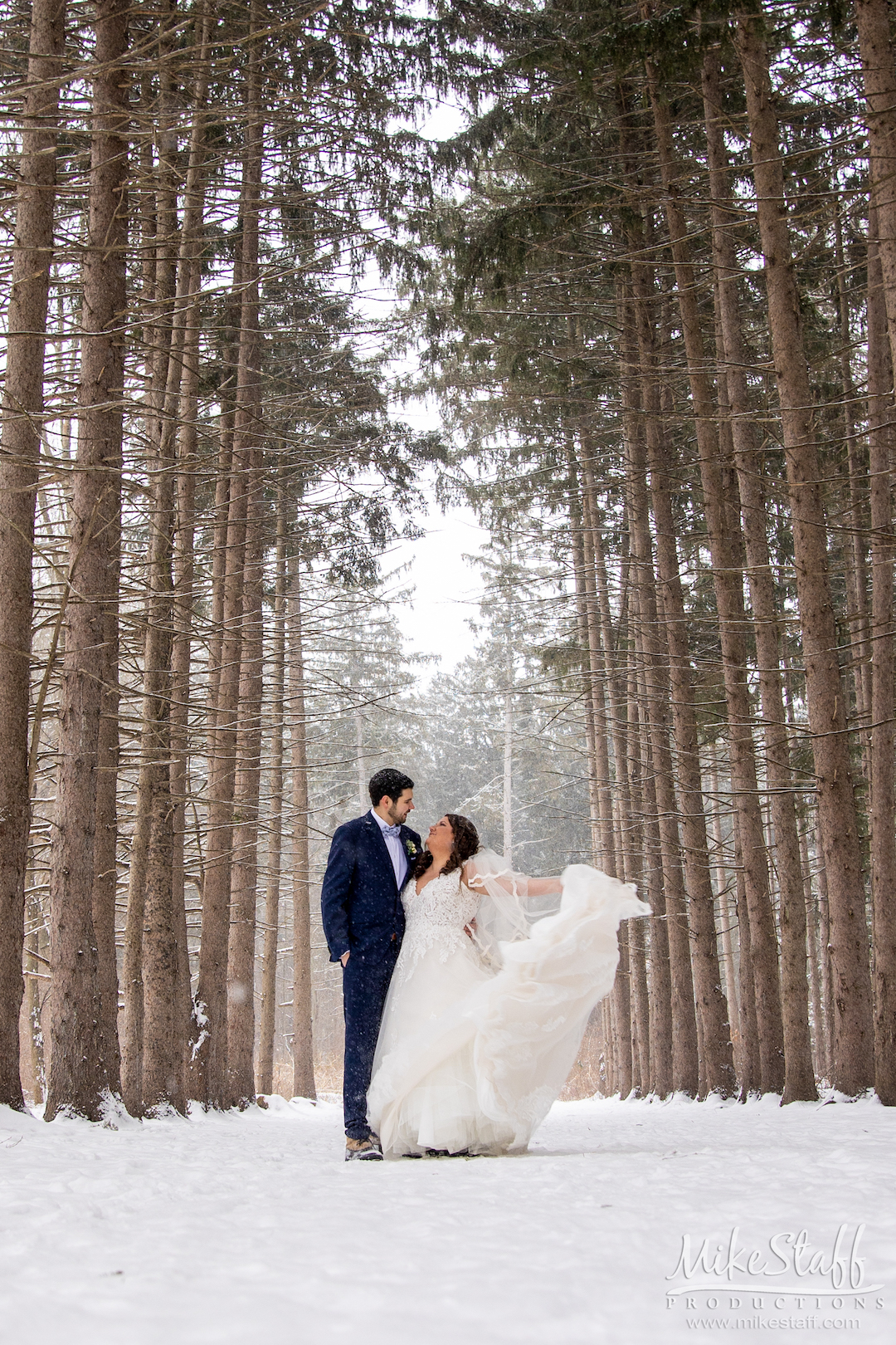 bride and groom outside in winter