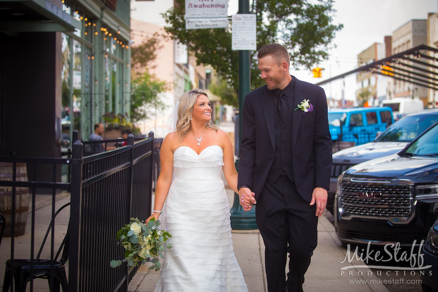 bride and groom walking in pontiac