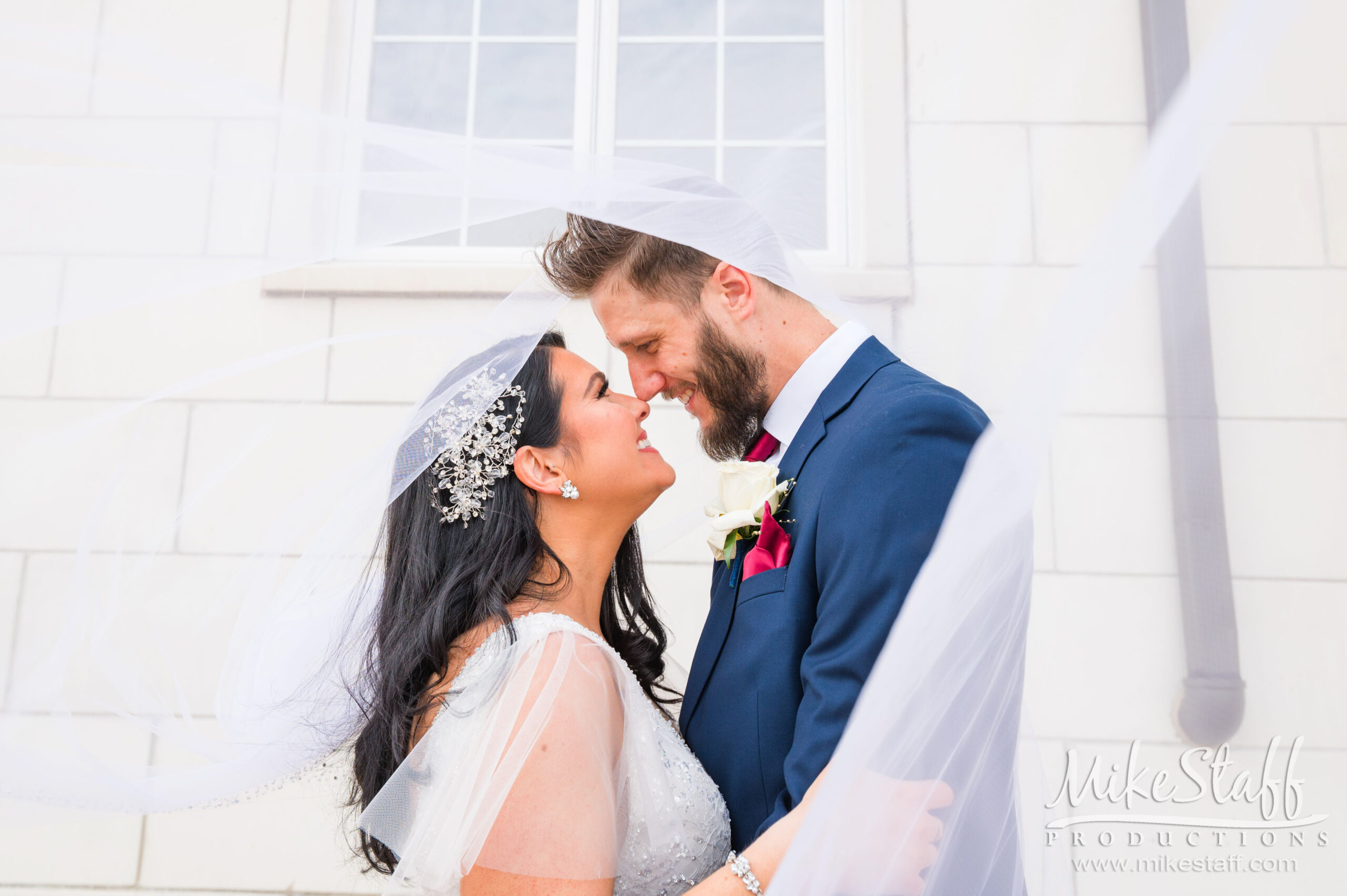 jessica and michael wrapped in bridal veil