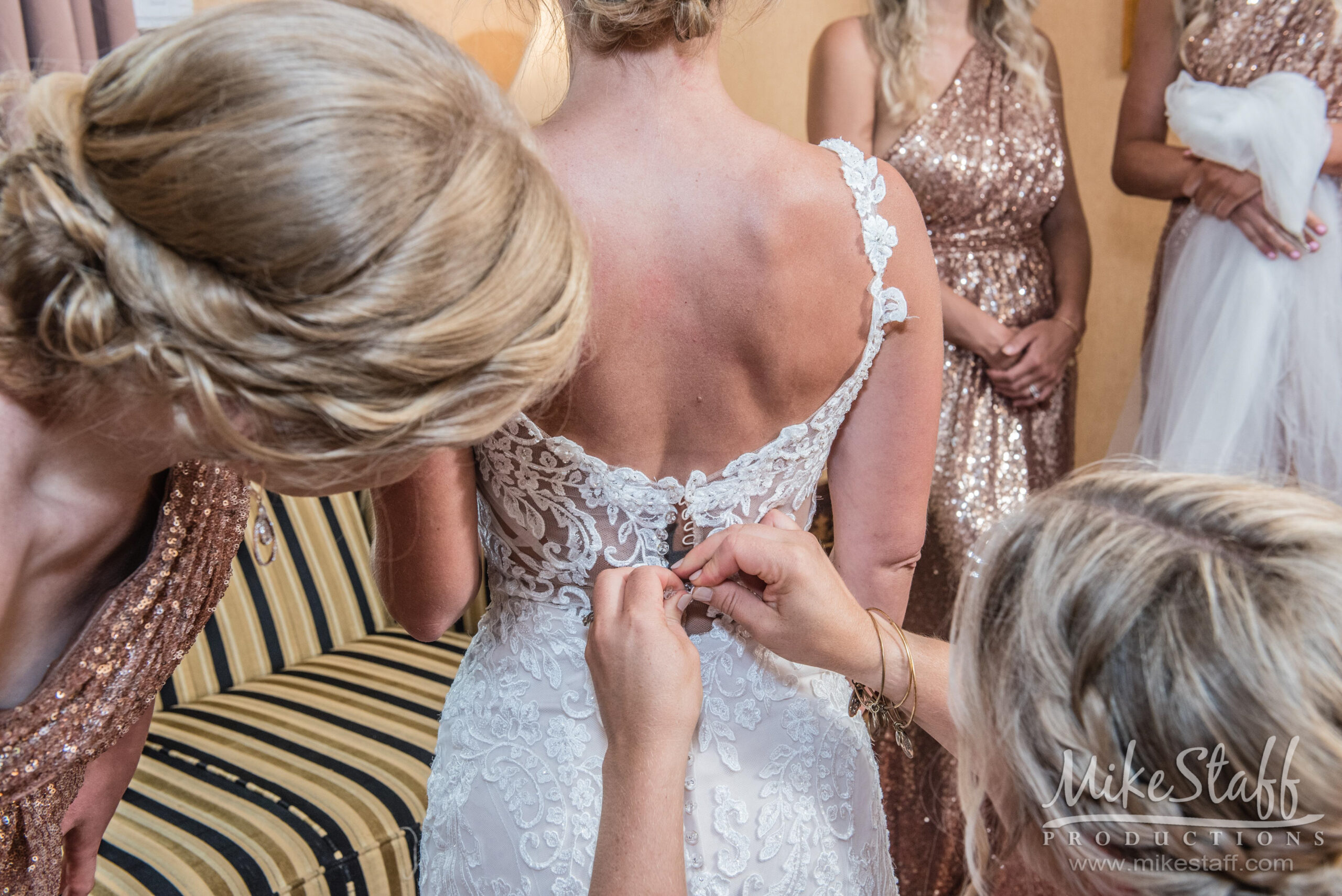 bride getting dress on