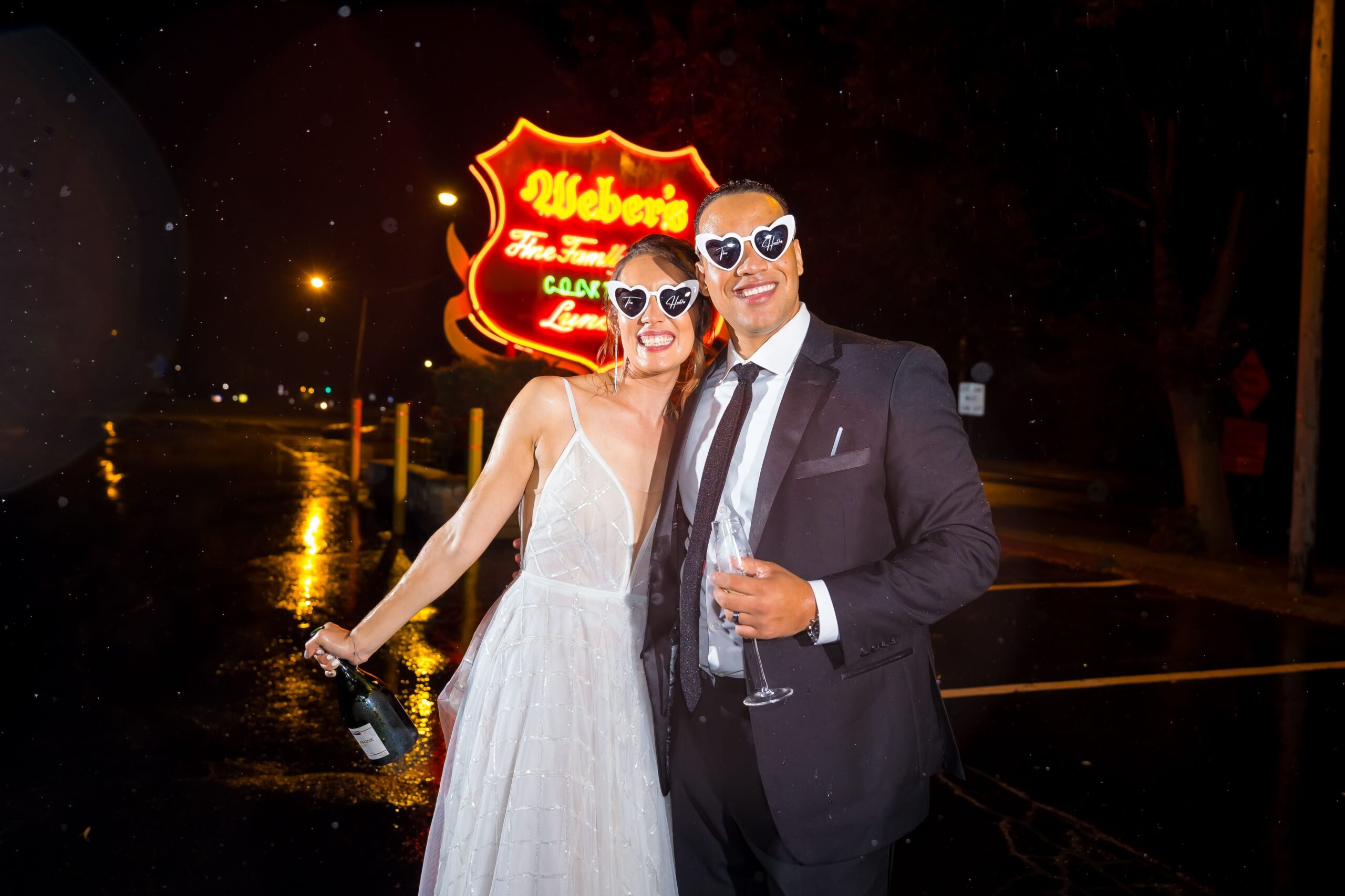 Detroit Wedding Photography_Mike Staff Productions_Webers Hotel_bride and groom in front of neon wedding sign