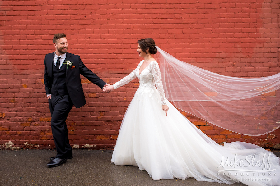 downtown holly bride and groom walking