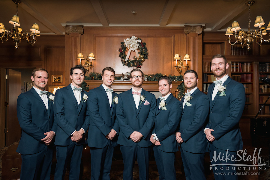 groomsmen in navy suits