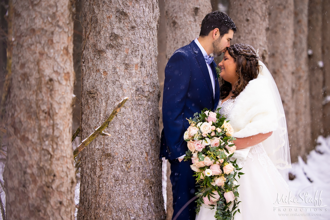 intimate moment between bride and groom outside in winter in metro detroit