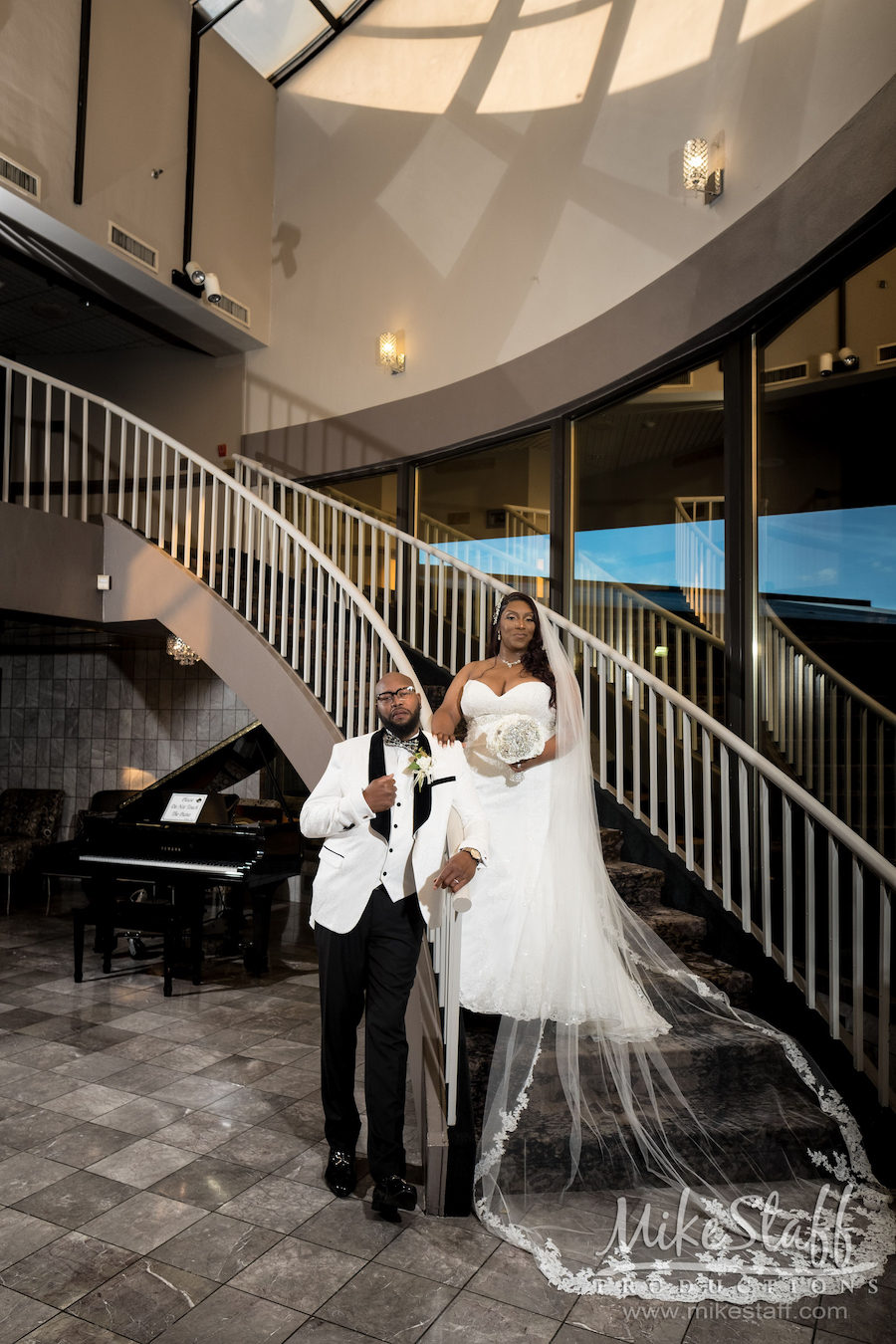 Lomyda and Eric on stairs at laurel manor