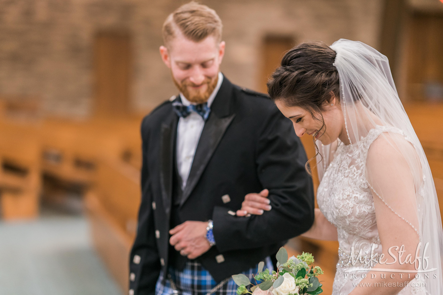 candid wedding photography abby and garret walking down aisle