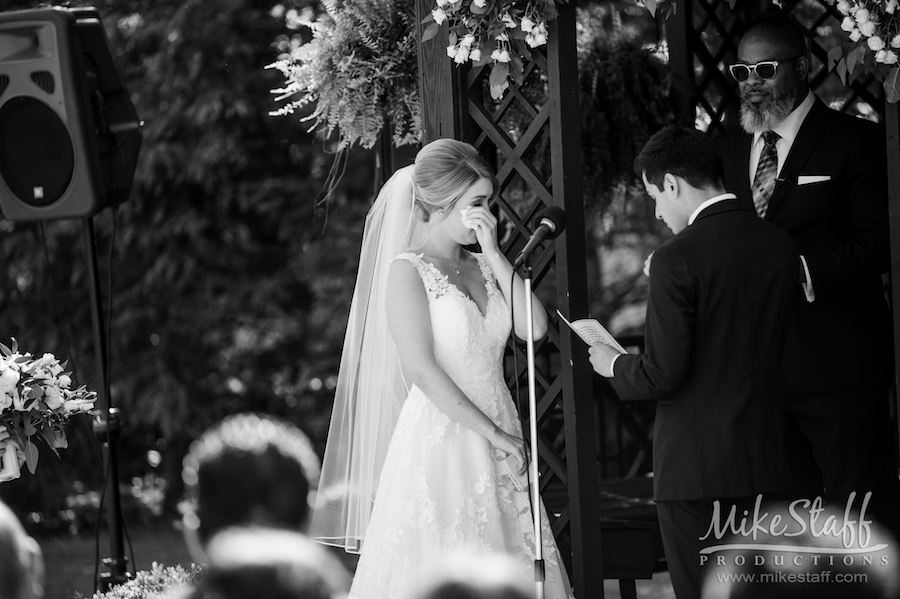 bride tearing up during ceremony