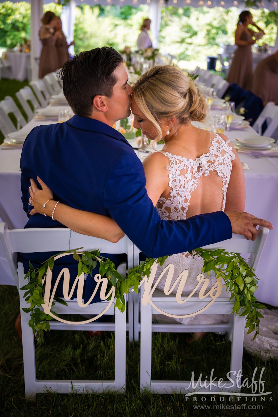 bride and groom at reception table