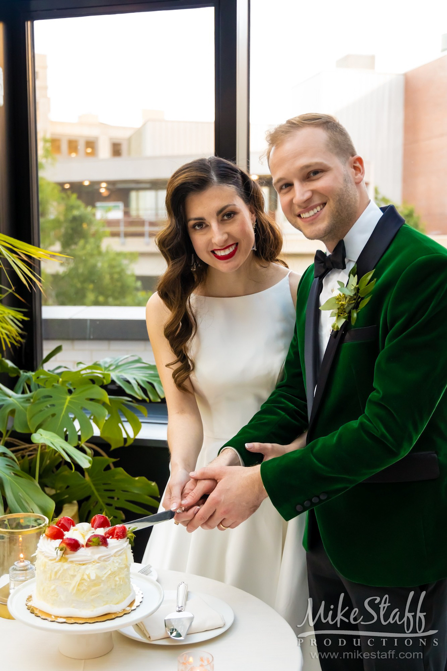 bride and groom cutting cake Shinola Hotel