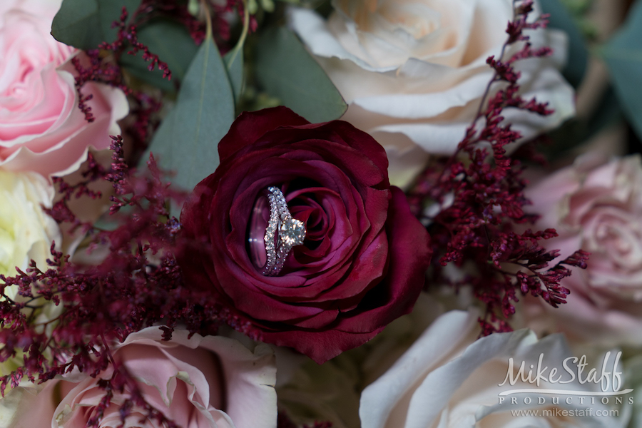 dezarae and charles wedding rings in flowers