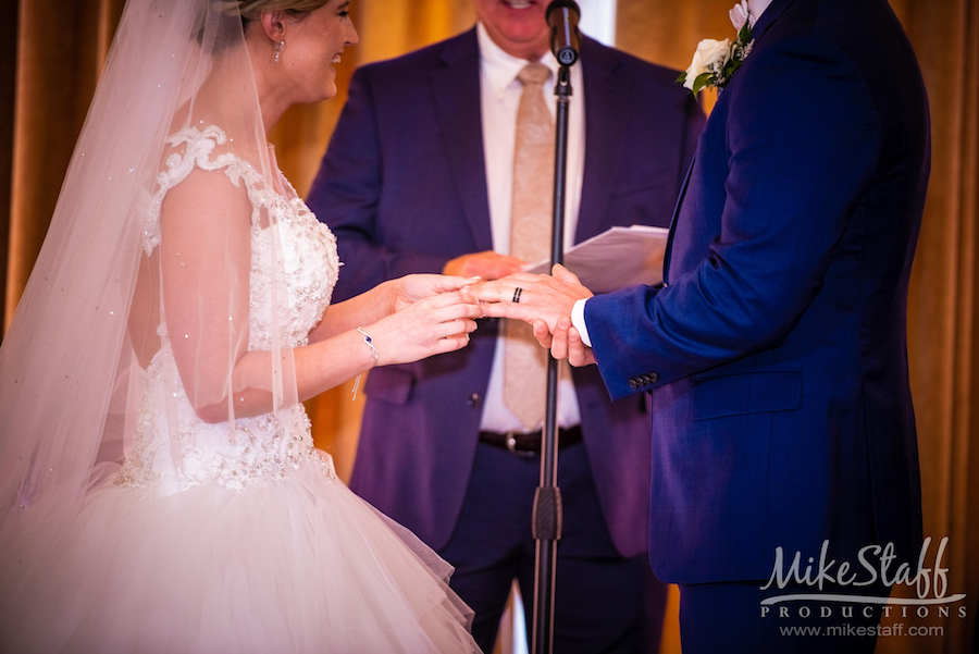 bride and groom exchanging rings