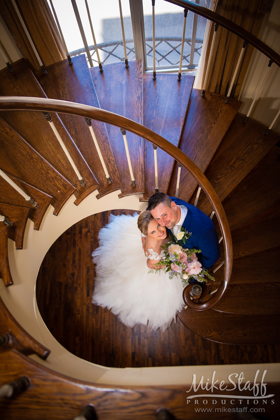 wedding photos on staircase at colony club