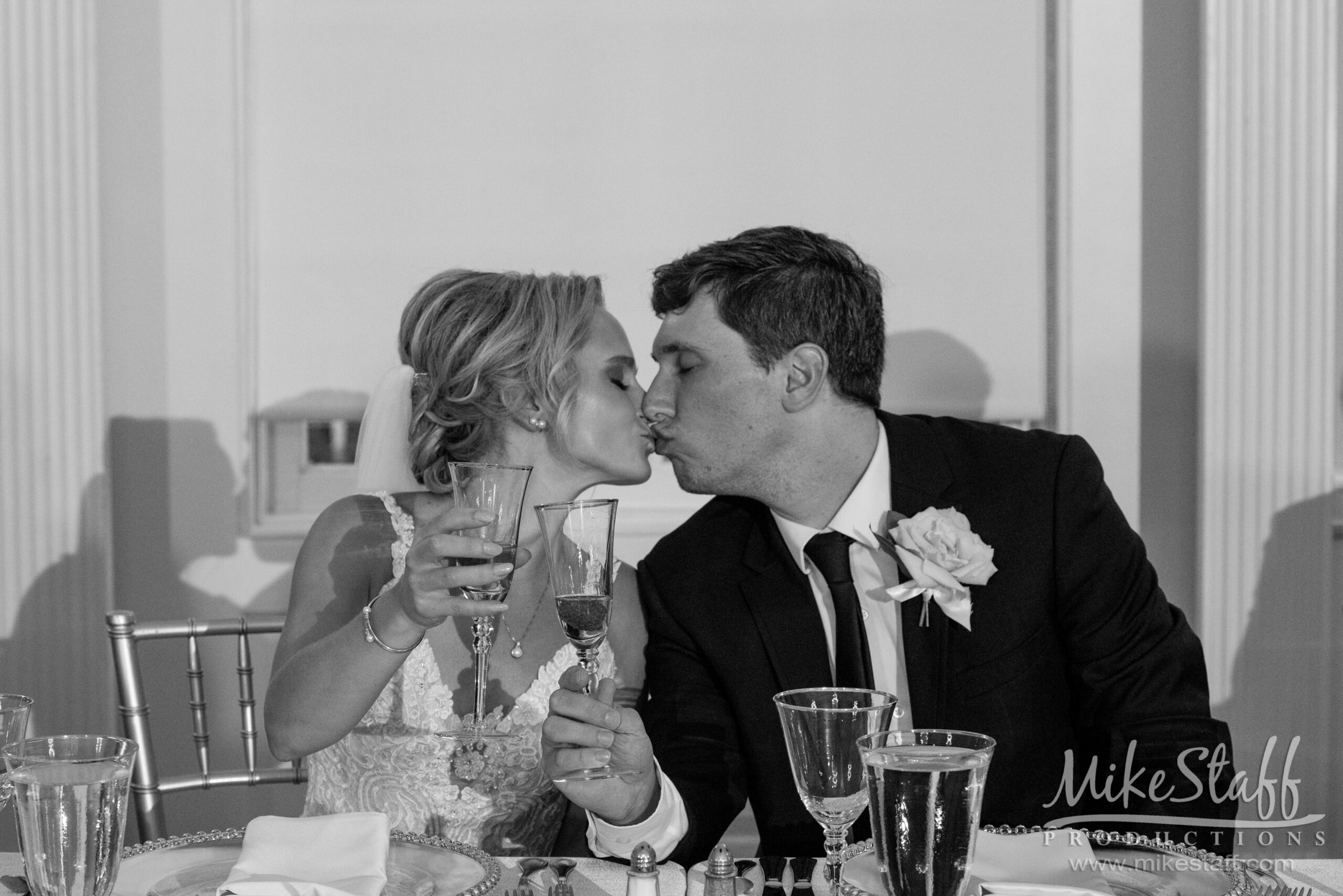 rebecca and kyle kissing at reception