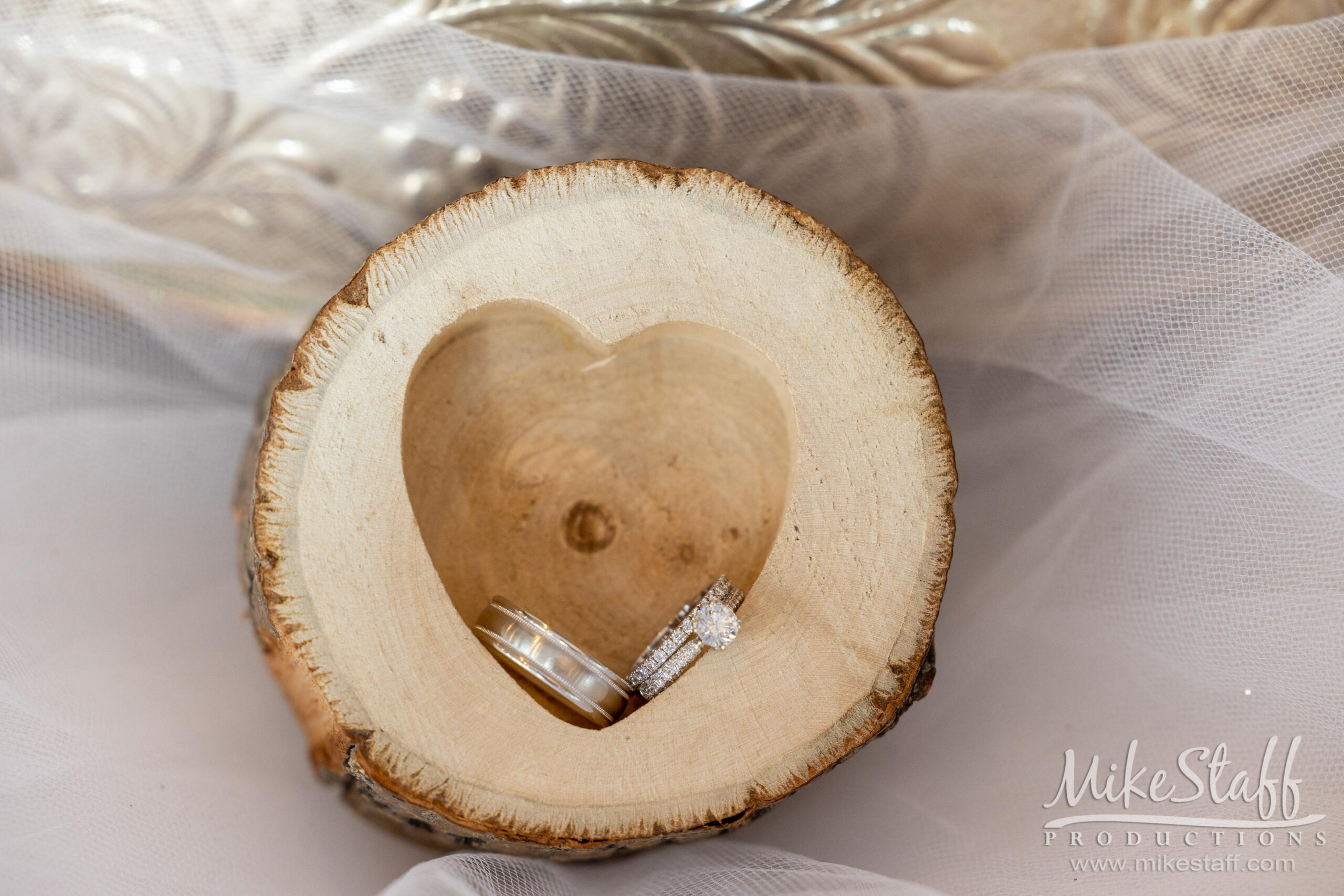 rings in wooden heart case