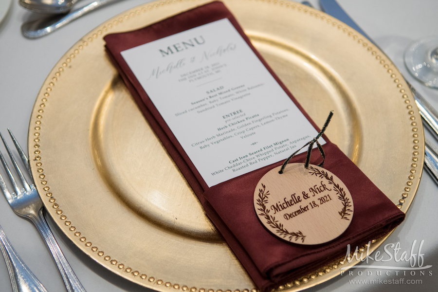 wedding menu on gold charger plate