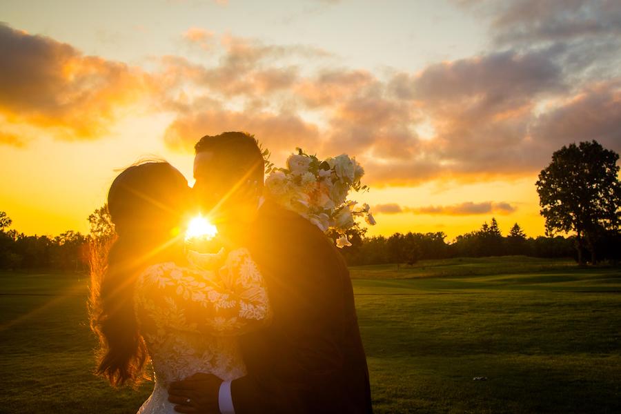 Detroit Wedding Photographer at fox hills_sunset wedding photos couple kissing Wedding Photography and Videography Packages